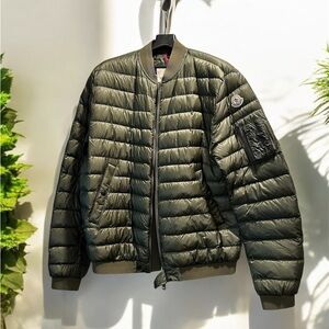 Moncler Dark Olive Green Puffer Jacket with Stand-Up Collar and Ribbed Cuffs